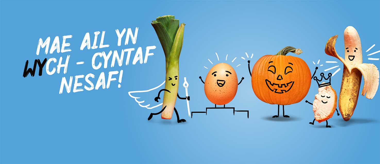 Delwedd o genhinen, wy, pwmpen, sleisen o gyw iâr a banana gydag wynebau darluniadol. Mae'r testun yn darllen: Mae ail yn wych - cyntaf nesaf!